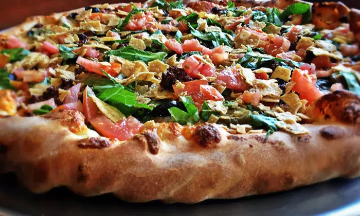 Thin Crust or Stuffed Pizza at Famous Yeti's Pizza (Up to 43% Off). Three Options Available. - Primary Image