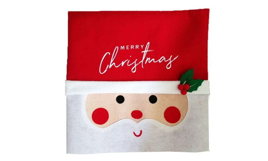 Image 2: Pack of Two or Four Festive Santa Chair Covers