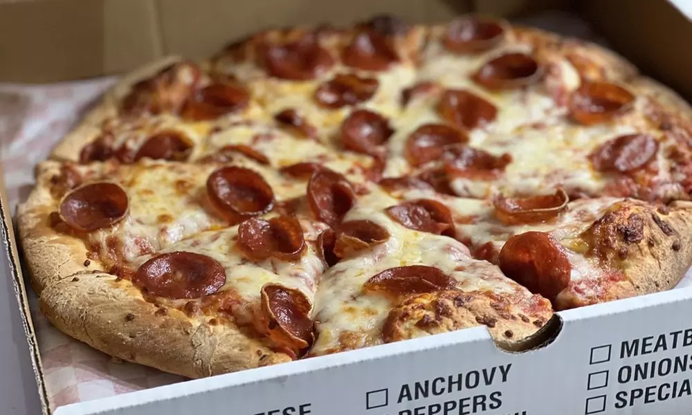 One or Two Large Pizzas with Two Toppings, 2 Liter of Soda and More
