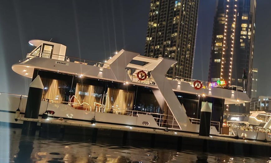 Image 1: Luxury 5-Star Dubai Canal Dinner Cruise for 1, 2, or 4 Adults