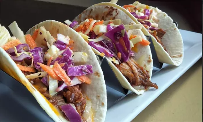 $28 for $40 or $39 for $60 on American Jamaican Casual at The Pint Publik House (Up to 35% Off) - Second Medium