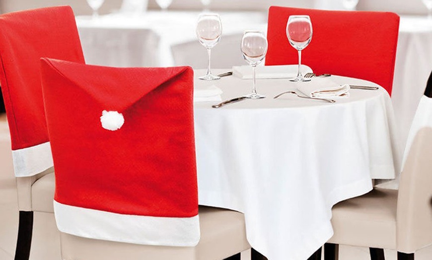 Image 4: Santa Hat Dining Chair Covers
