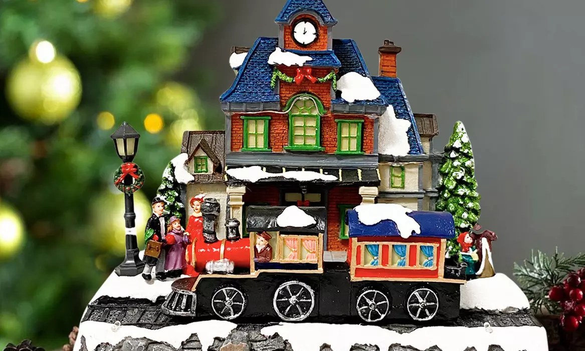 Adorno navideño "Aldea de Navidad" con luces de colores y melodía