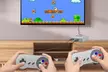 Reproduction de la console de jeu "Super Mini SFC" possédant plus de 600 jeux, accompagnée de deux manettes - Image 2