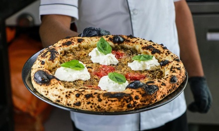 Enjoy Authentic Neapolitan pizza at the picturesque Hudayriyat Beach