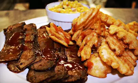 Dinner for Four or $15 for $30 Worth of Barbecue and Comfort Food at The Bull n' Barrel - Primary Image