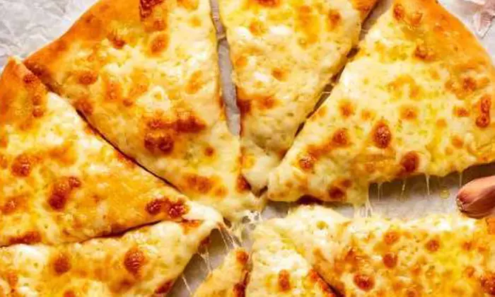 Savor Medium Pizzas or Pasta + Small Garlic Pizza