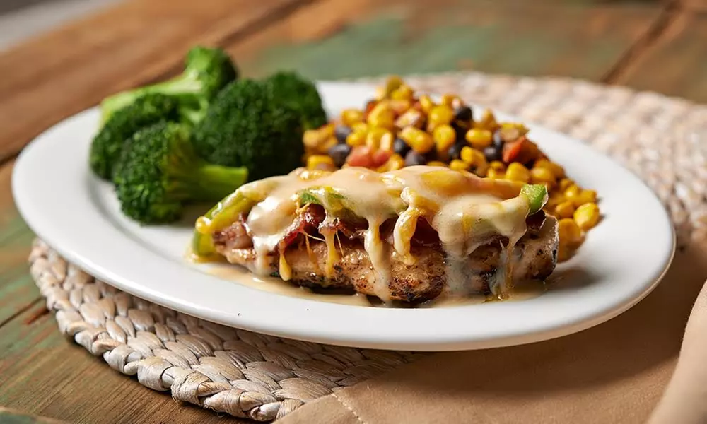 $9 for $16 Worth of Food and Drink at Hurricane Grill & Wings - Mobile - Second Medium