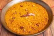 ¡A la rica paellita! Menú de arroz para llevar para 2 o 4 personas con botella de vino con 43% de descuento - Second Medium