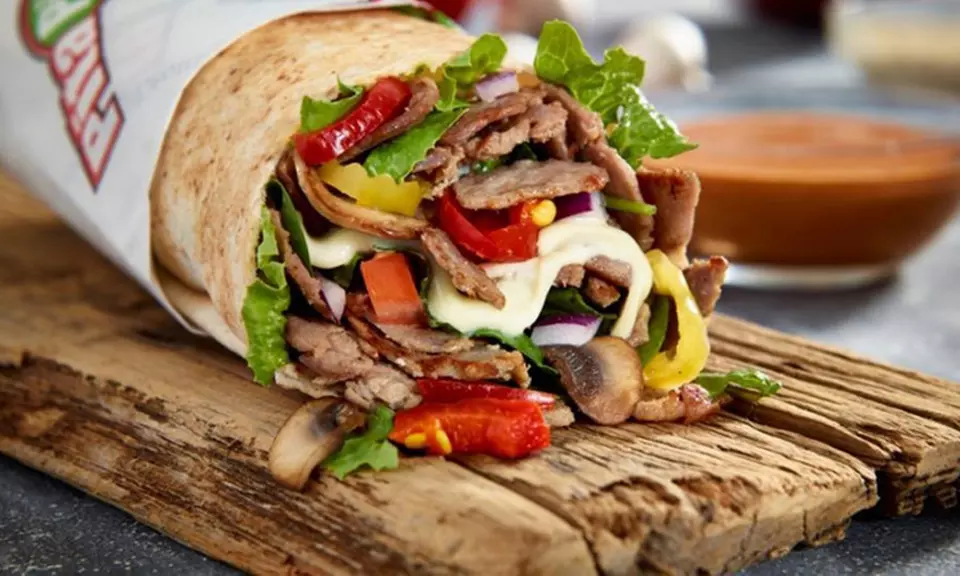 Entree and Canned Drink for Two or Four at Pita Pit (Up to 50% Off) - Primary Image