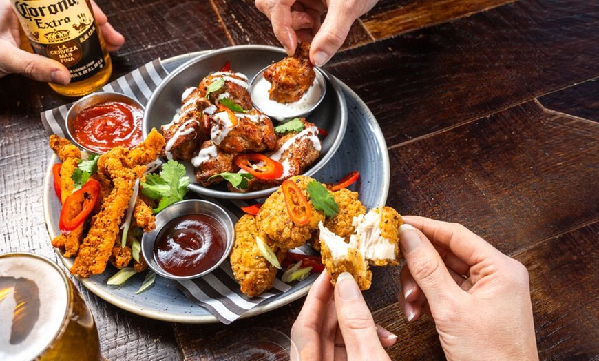 Image 12: Two Starters and Two Skillets at ⭑★ Sizzling Pub & Grill ★⭑