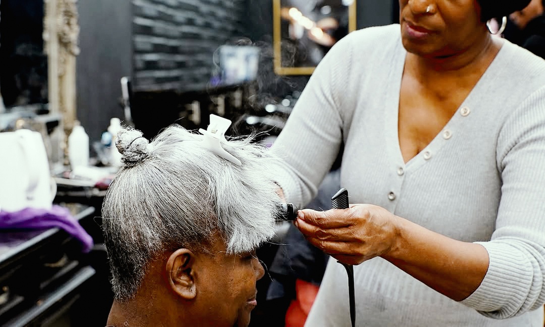Women's Haircut, Curly Haircut, or Highlights with Consultation
