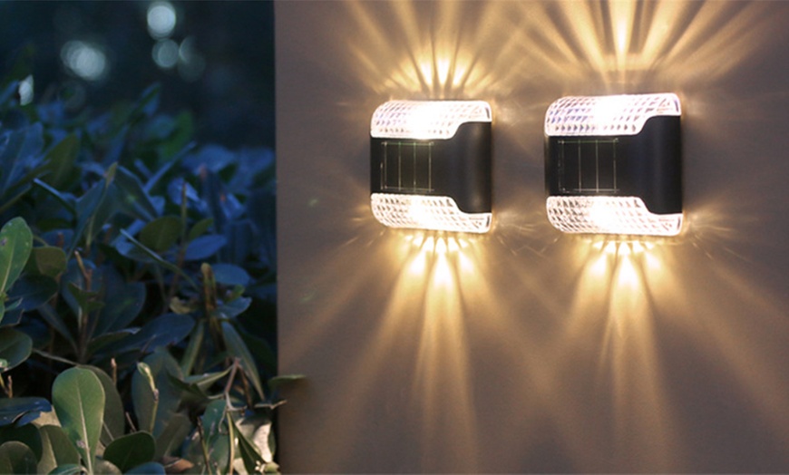 Image 2: Two or Four Piece Solar Up And Down LED Wall lights