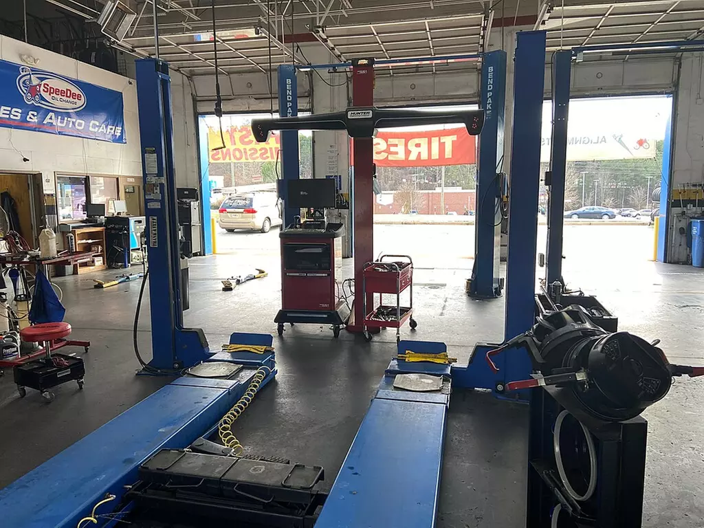 All-Wheel Alignment at SpeeDee Oil Change Tire and Auto Care (Up to 37% Off). Six Options Available. - Primary Image
