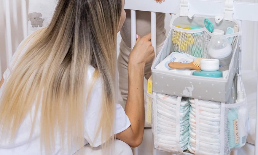 Image 3: Cradle Star Hanging Nursery Organizer - Multi-Compartment Baby Changing Table Storage Caddy with Door Hook