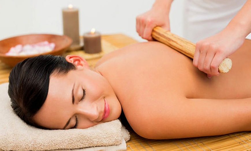 Image 1: Unwind with 60-Minute Bamboo Full Body Massage with Prosecco