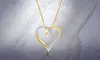 1/10 CTTW Diamond Heart Loop Pendant in 10K Gold by DiamondMuse