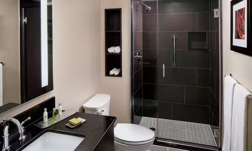Image 11: Modern 4-Star Stay w/ Pool, Dining, & SNHU Arena Convenience