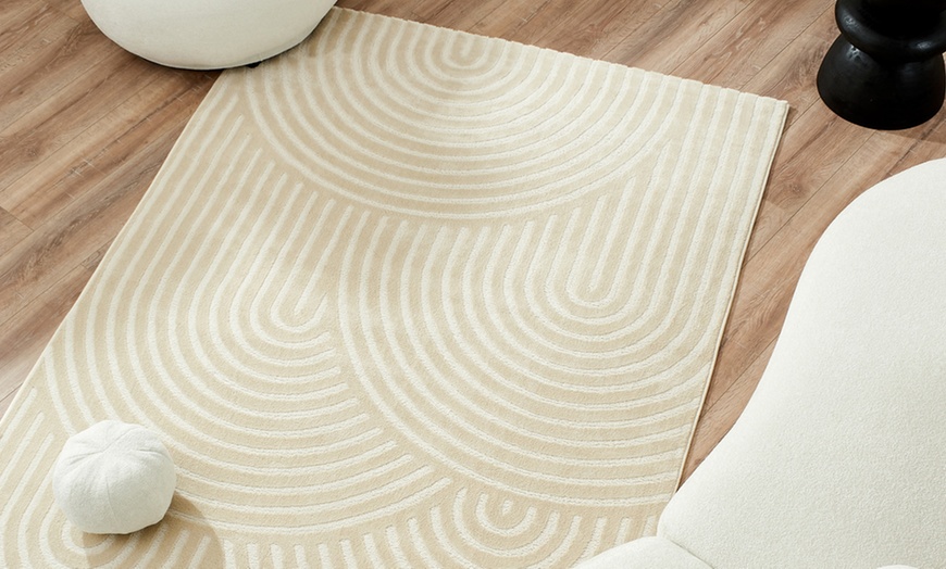 Image 1: Tapis à relief clair avec un design Art Déco