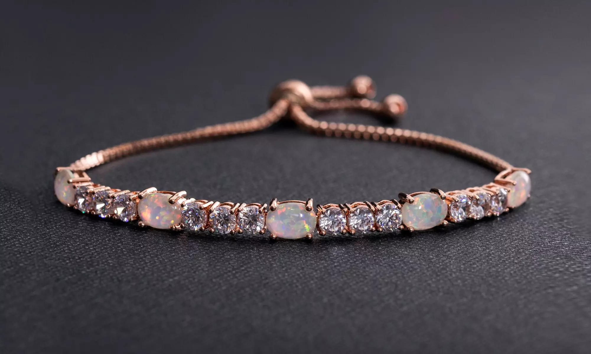 Fiery Opal Adjustable Tennis Bracelet Made with Swarovski Elements in Gold Plating by Nina Grace - Primary Image