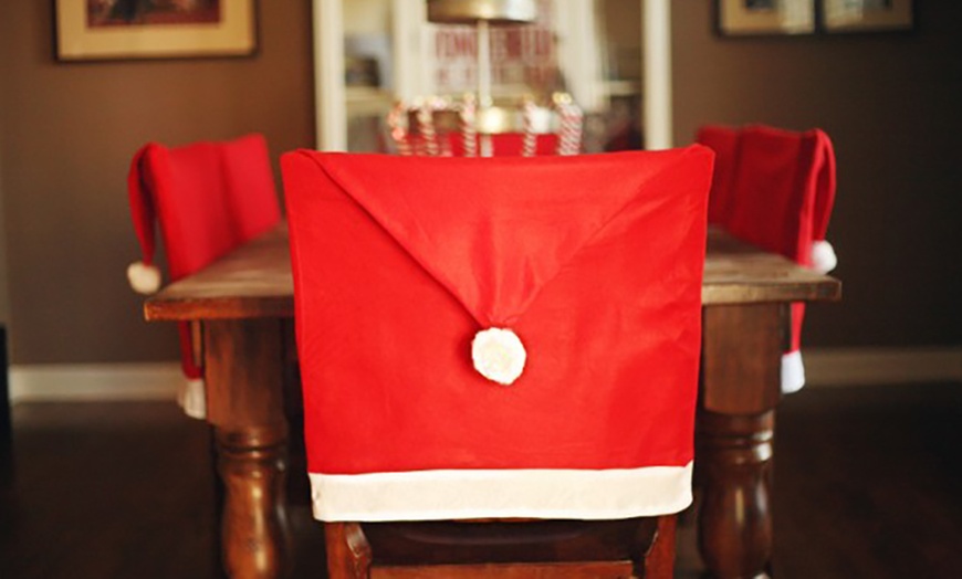 Image 3: Santa Hat Dining Chair Covers
