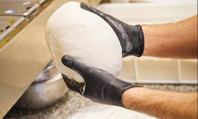 Enjoy a Pizza Making Class for One, Two, or Four with Drinks