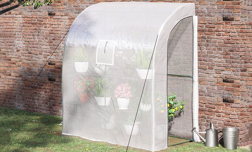 Image 1: Outsunny Walk-In Lean to Wall Greenhouse with Windows and Doors
