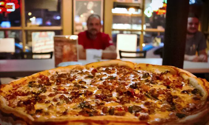 $10 for Two vouchers, Each Good for $10 Worth of Pizza at Mikey's Late Night Slice ($20 Total Value) - Primary Image