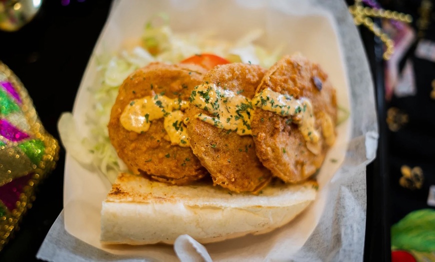 Image 8: Two Po'Boys, Meals for Two or Four With Beignets, and $50–$75 Credits