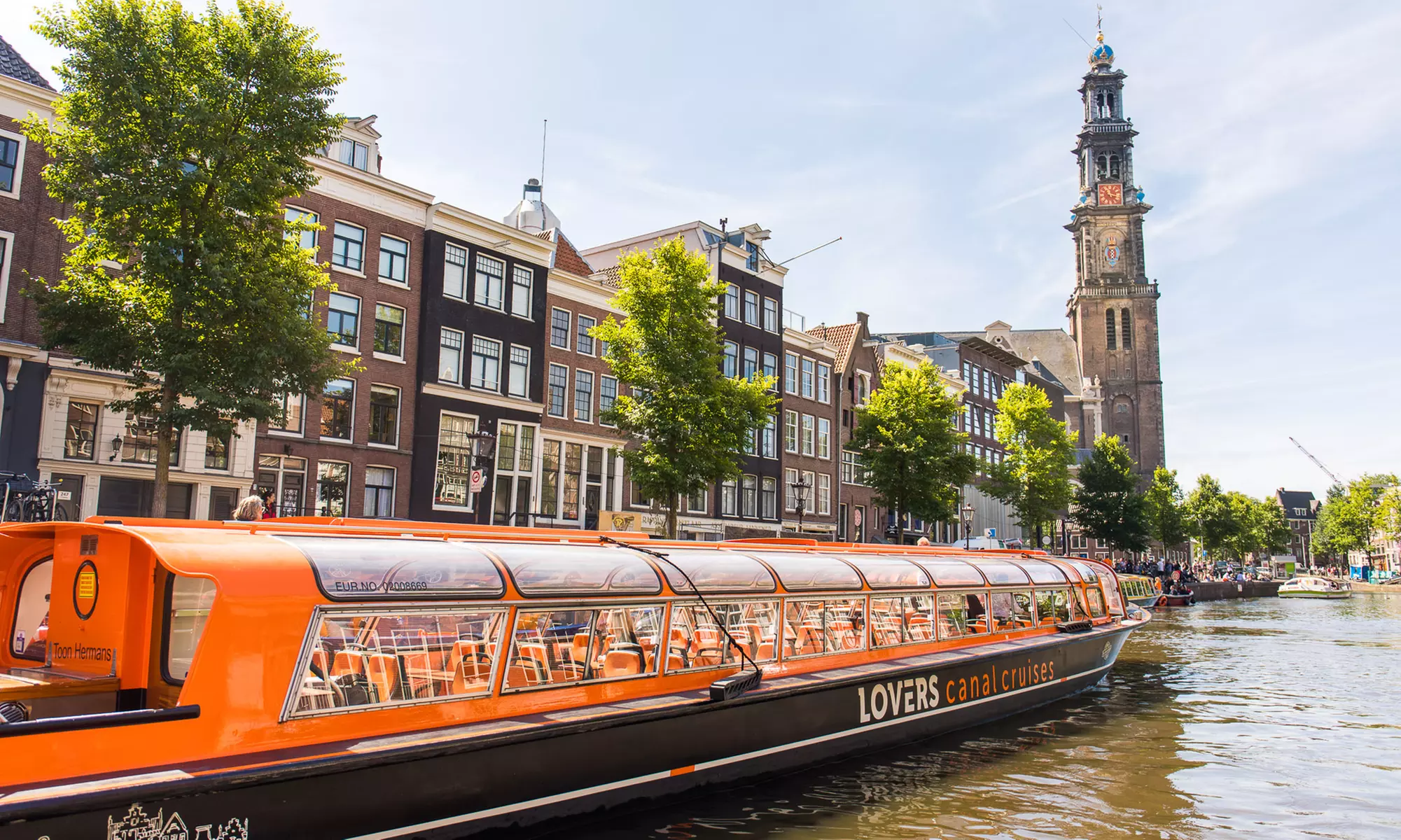 Erkunde tagsüber oder abends die ikonischen Grachten von Amsterdam