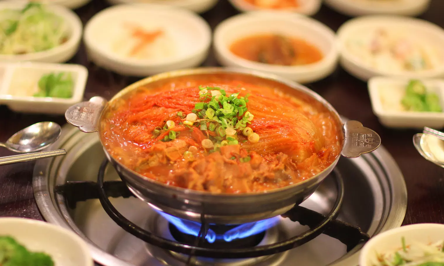 One or Two Korean Aged Kimchi Hot Pots and One Appetizer for Two or Four at Mukeunji (Up to 49% Off)  - Primary Image
