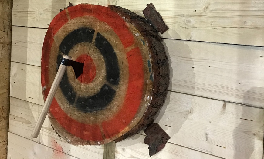 Image 1: Unleash Your Inner Warrior: Axe Throwing Sessions for Thrill-Seekers