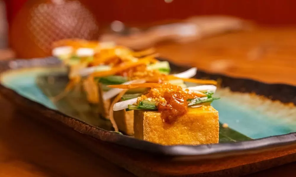 Savor $50 Dining Credit or Dinner with Cocktails for Two or Four