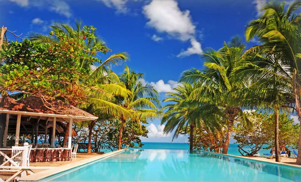 Stay with Meal-and-Beverage Plan at Coconut Beach Club in Antigua. Dates Available into September. - Primary Image