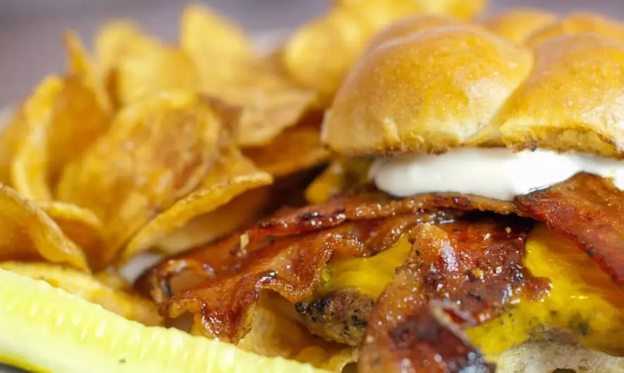 Wings, Bacon, Burgers, Pizza, and More at Saloon on Calhoun (Up to 40% Off) - Primary Image