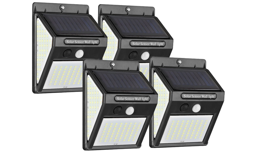 Up to Eight 140-LED Solar Security Wall Lights | Groupon