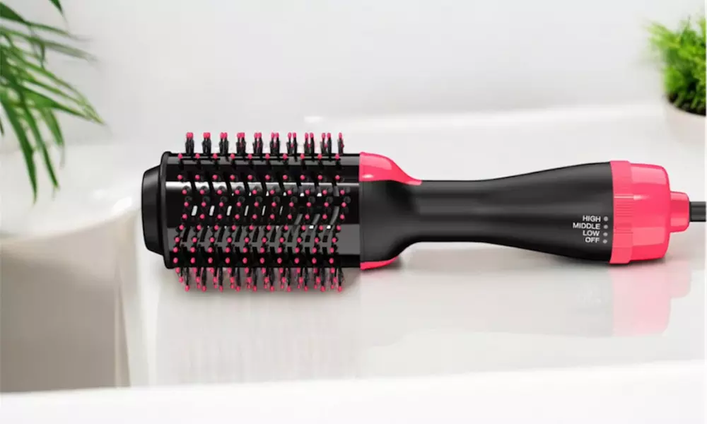 Cepillo secador moldeador para aportar volumen o alisado al cabello - Primary Image