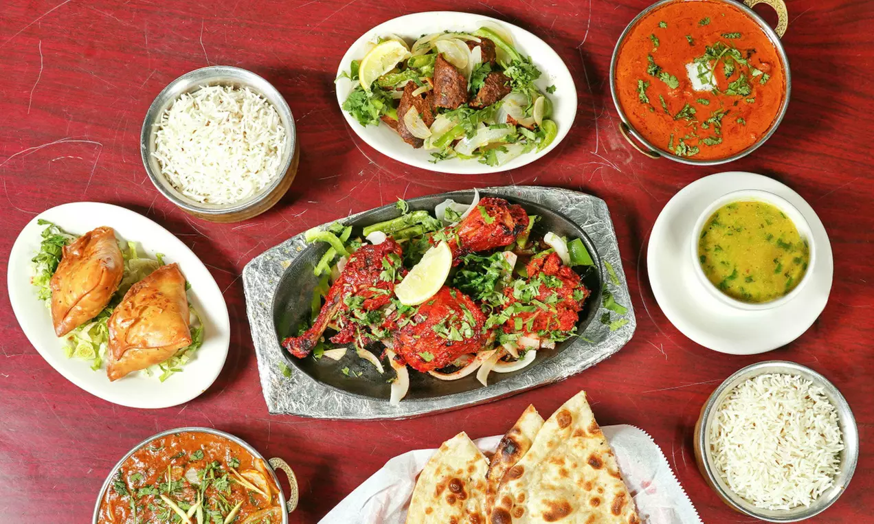 Food and Drink for Takeout and Dine-In If Available at Divine Indian Cuisine (Up to 30% Off). Three Options.  - Primary Image
