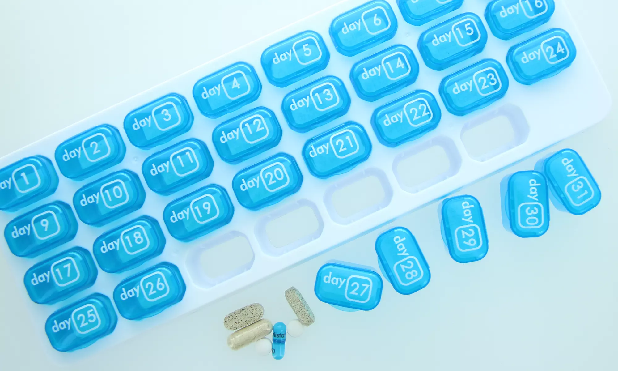 Portable 31-Days Pill Organizer Box with Daily Pop-out Container - Primary Image