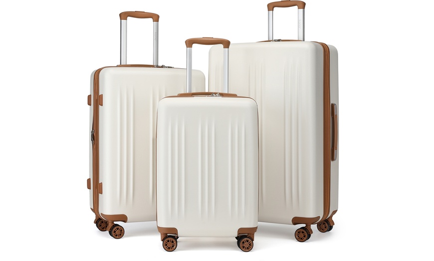 Image 8: One- or Three-Piece Sleek Striped Expandable ABS and PC Suitcases