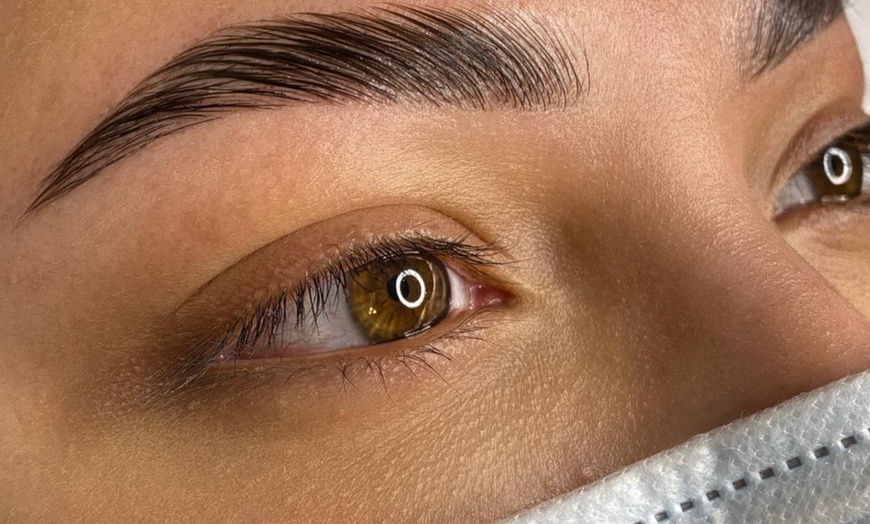 Image 1: Perfectly shaped, fuller brows w/ eyebrow lamination & tint treatment