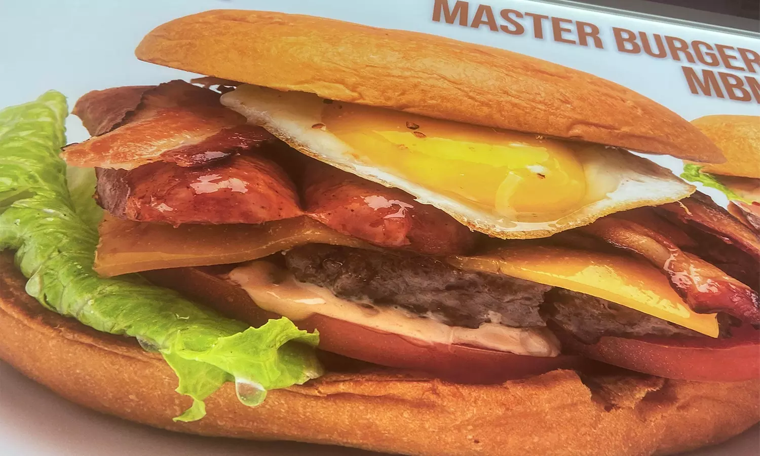 Casual American Food and Drink for Takeout and Dine-In at Master Burger Meister (Up to 30% Off). Two Options. - Primary Image