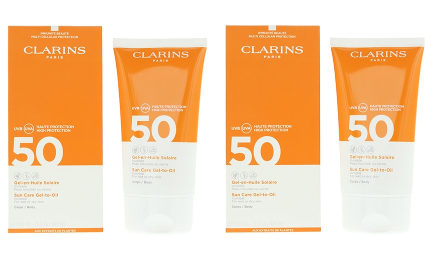 Image 1: Pack of Two Clarins SPF50 Sun Care Gel To Oil 150ml