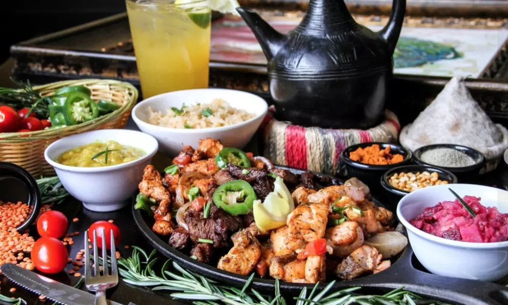 Ethiopian Food and Drink for Dine-In or Carryout from Desta Ethiopian Kitchen. Two Options Available. - Second Medium