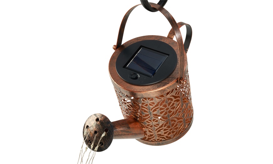 Image 5: Solar-Powered Illuminated Metal Watering Can Ornament