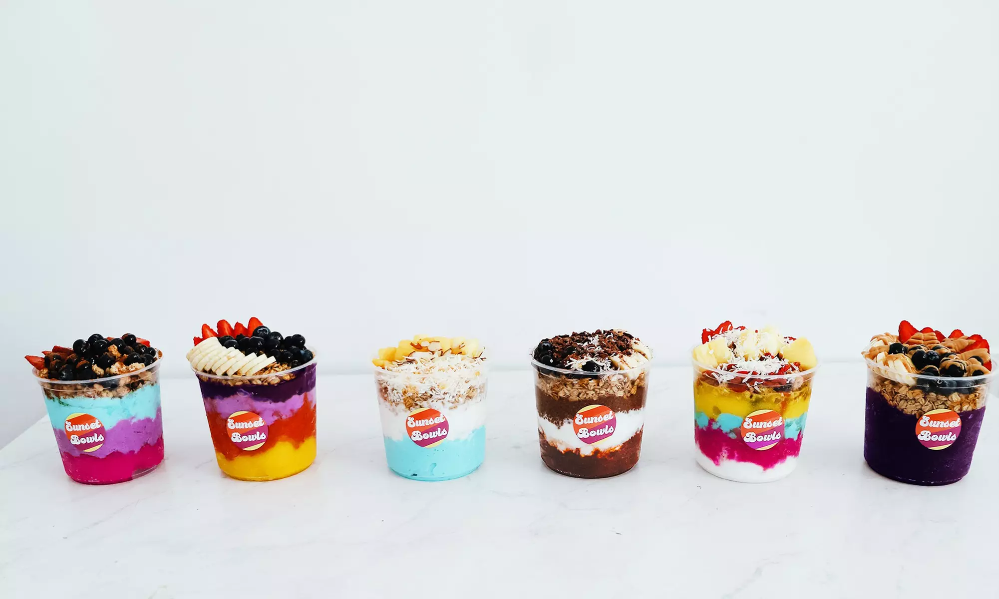 Explore Sunset Bowls for customizable smoothie and acai bowls with unlimited toppings, offering up to 30% off. - Primary Image