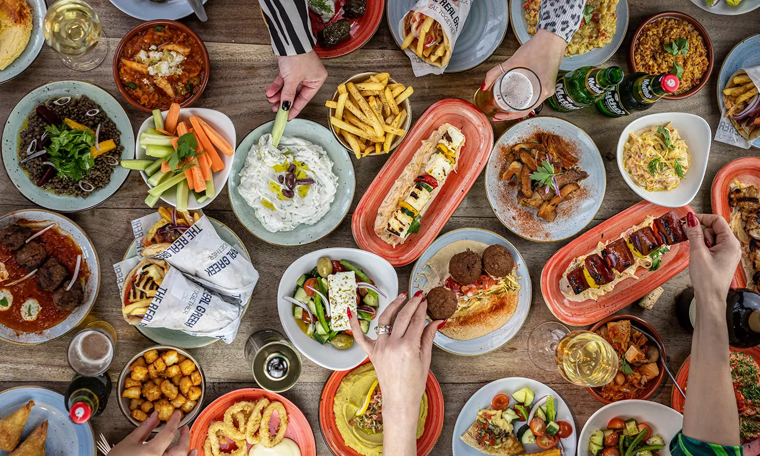 Six Greek Dishes, Flatbread, Crudites, and Two Desserts to Share for Two at The Real Greek (Up to 52% Off) - Primary Image