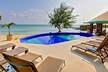 4- or 7-Night Stay for Two with Watersports and All Meals Included at Blackbird Caye Resort in Belize - Second Medium