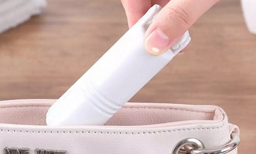 Image 6: Mini inklapbare en herbruikbare kledingroller