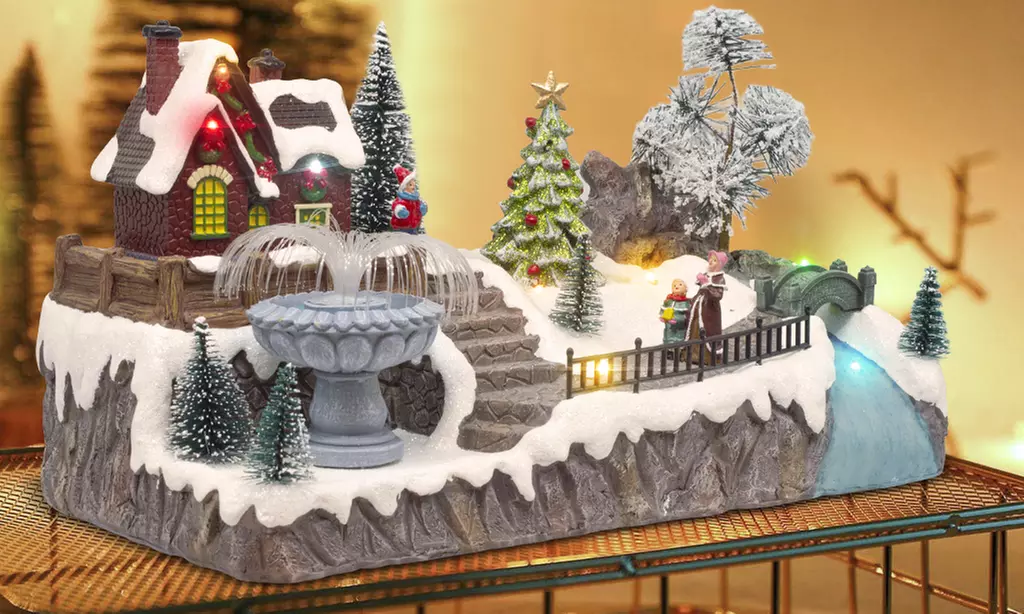 Adorno navideño "Aldea de Navidad" con luces de colores y melodía